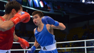 Кайрат Ералиев (в синем) против Омурбека Малабекова. Фото с официального сайта чемпионата мира
