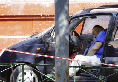 Тело убитого подполковника центрального аппарата МВД РФ Тамаза Брои в автомобиле. ©РИА Новости