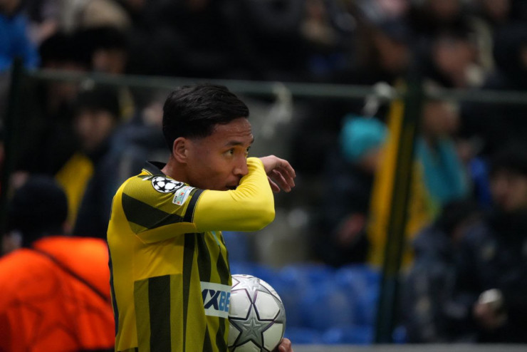 Еркин Тапалов в матче 